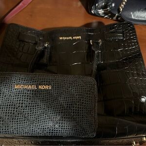Black Michael Kors wallet and purse with gold details